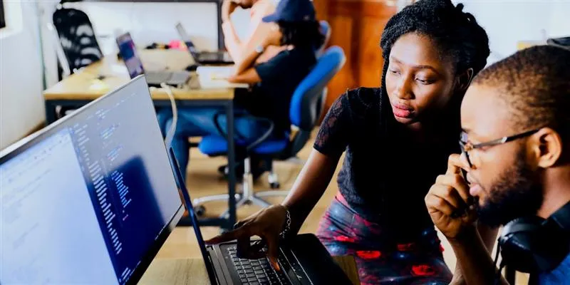 Youth learning computer skills at Sayam Foundation