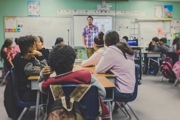 Teaching volunteer with children